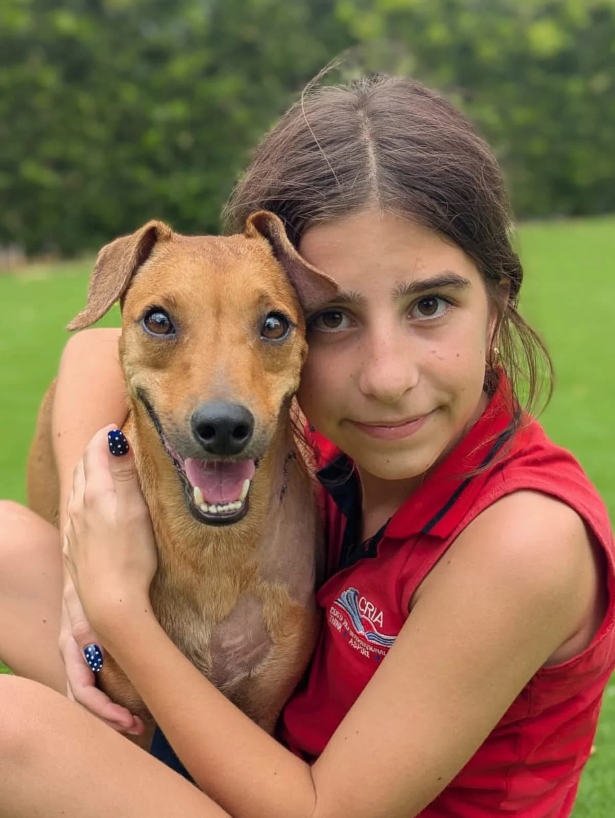 A child sharing a gentle moment with a rescue dog